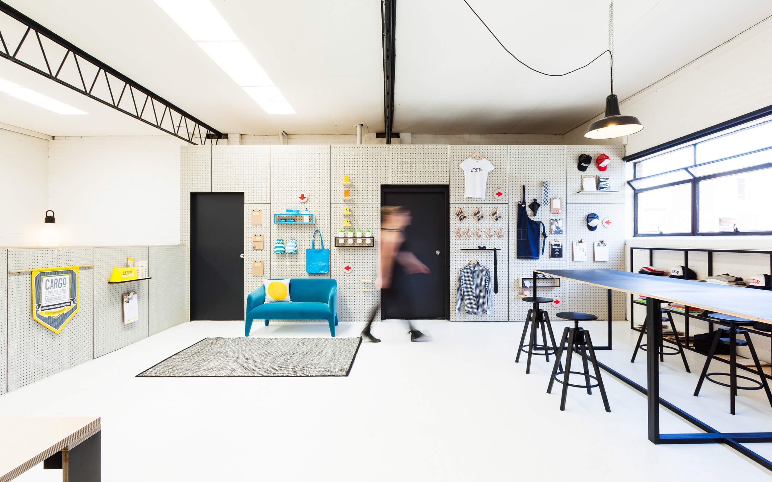 Main floor with desks and pegboard walls
