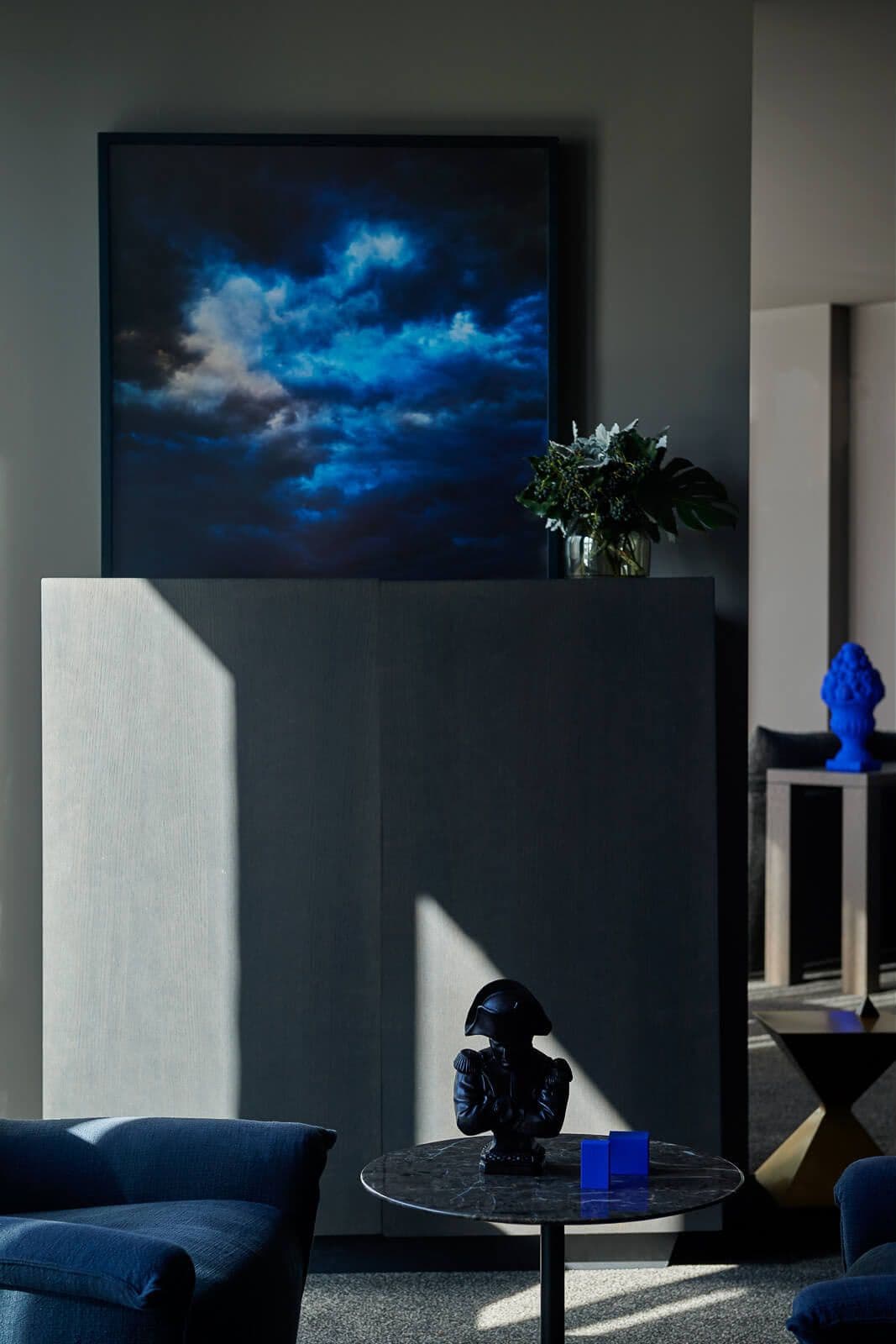 Painting on a mantle in dark blues