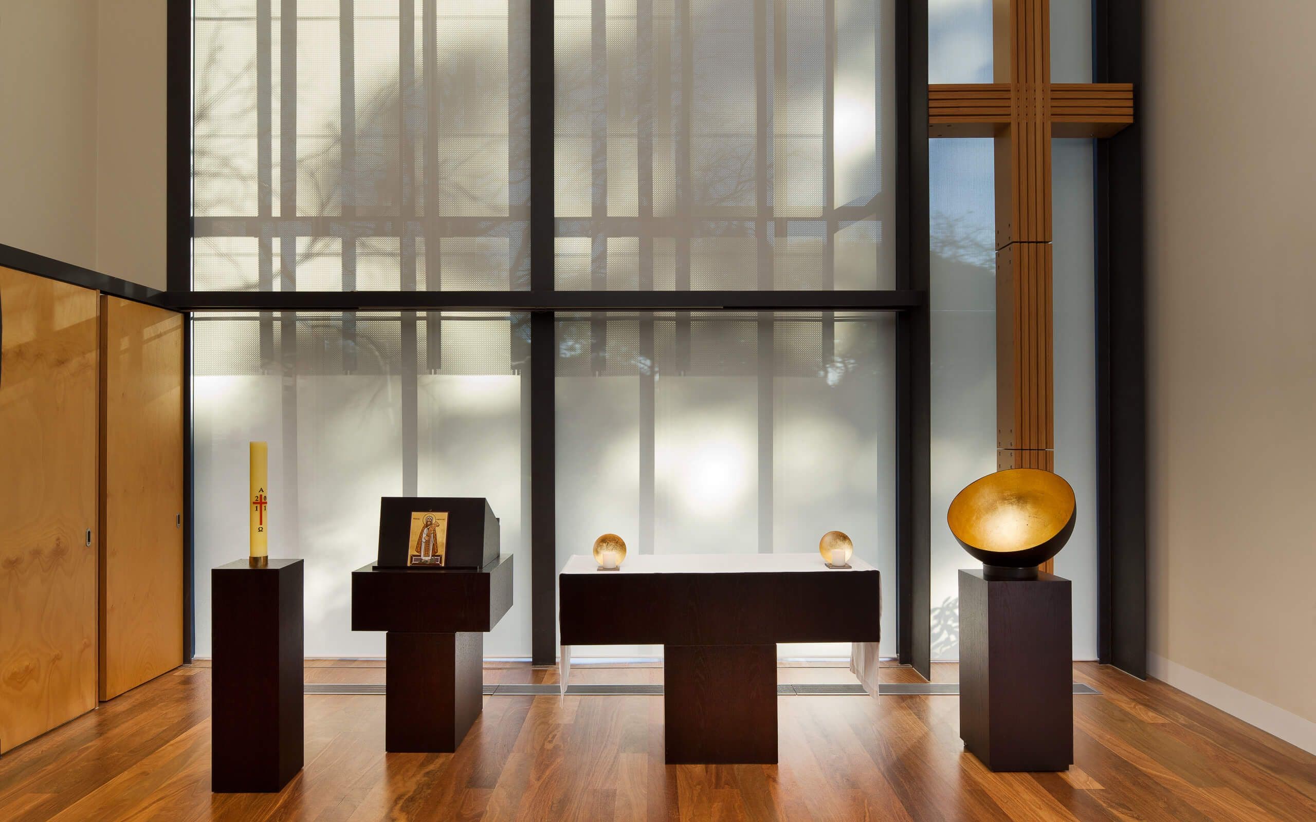 Items arrayed in a display room. Gold on black.