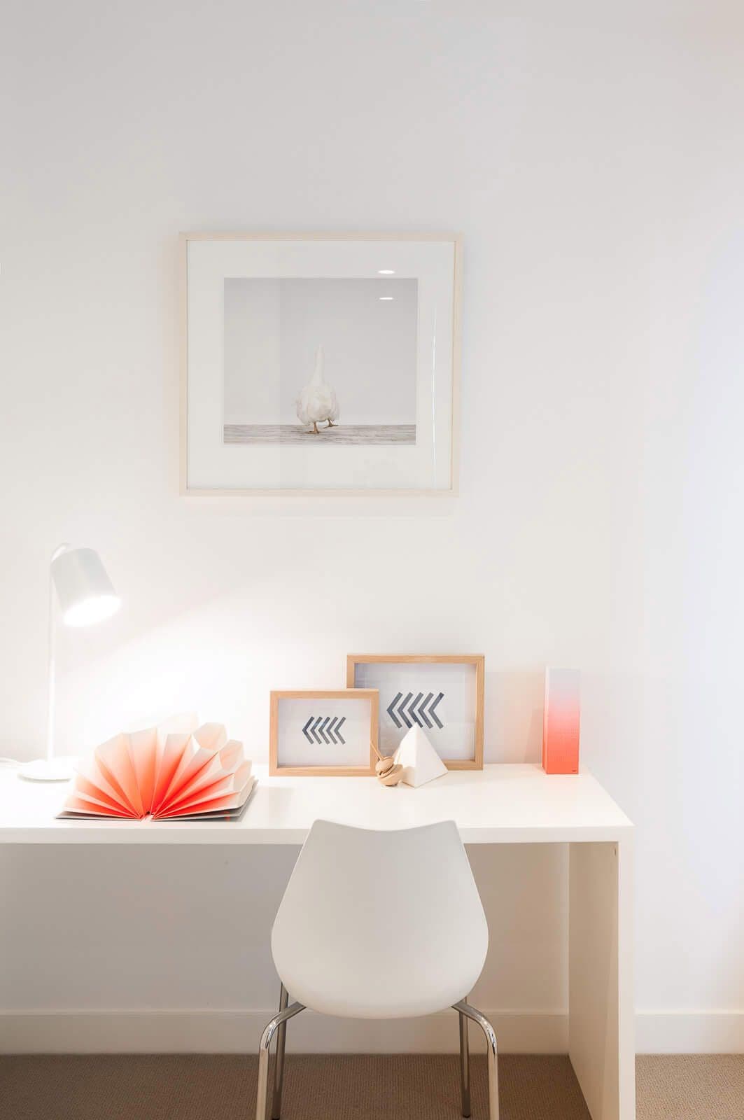 Study desk with pink accents in paper and items