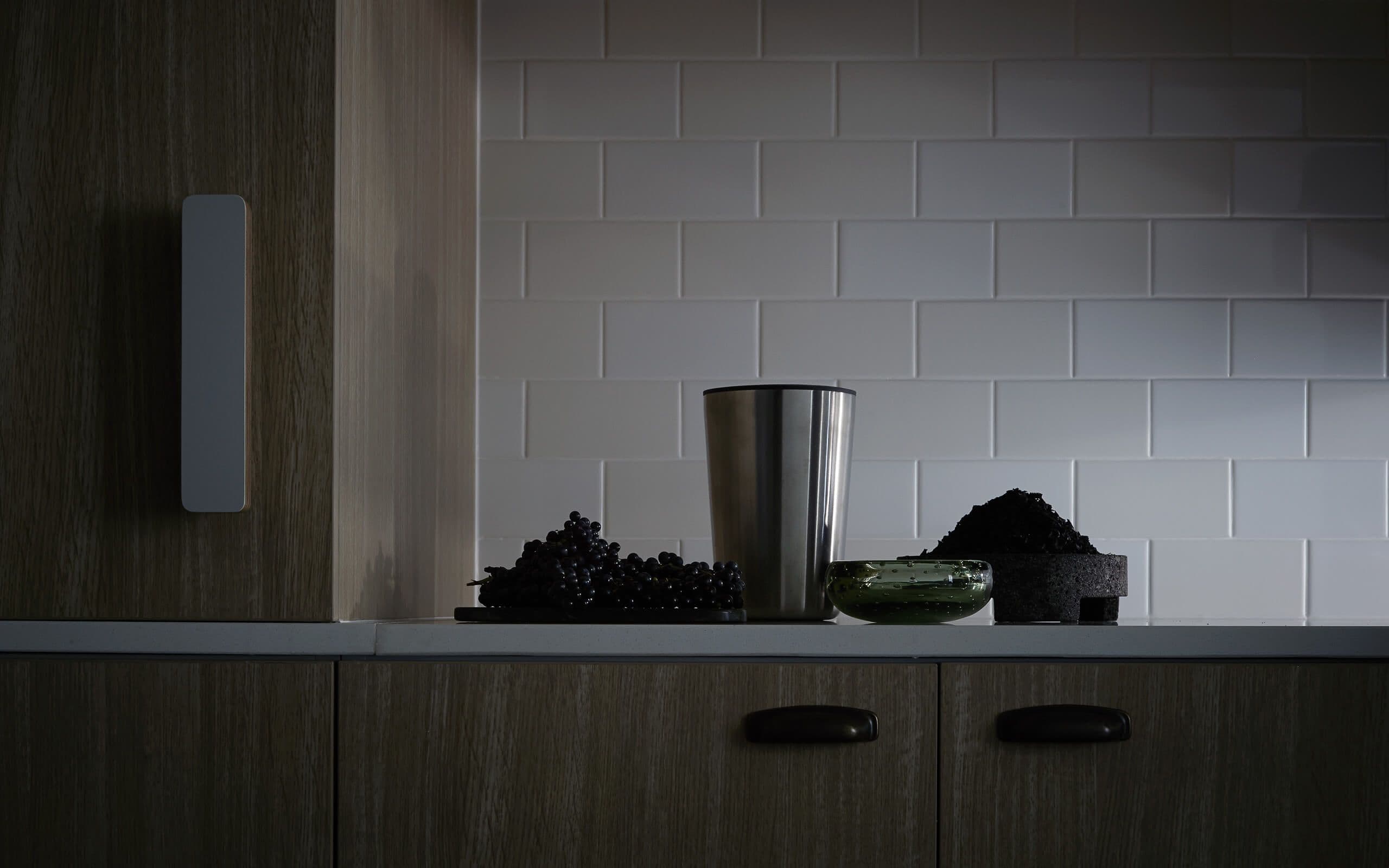 Metalic item on a counter, strong shadow