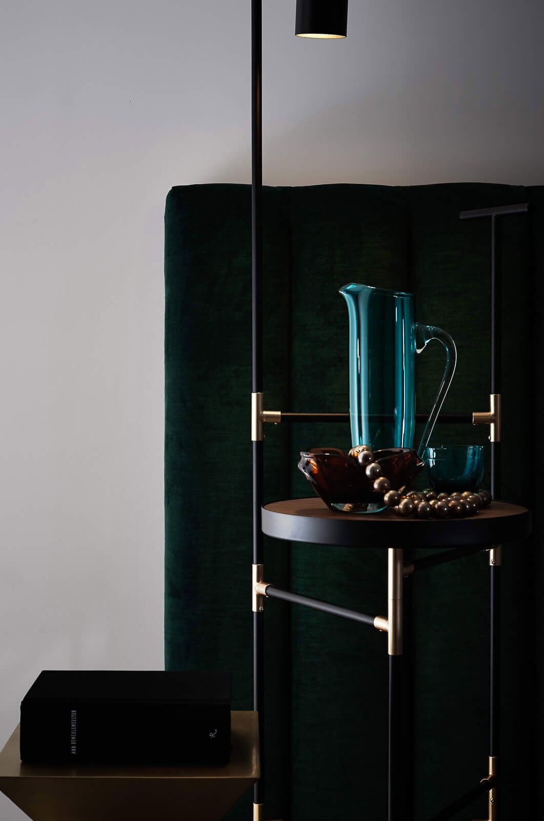 Side table details in glass with a white wall