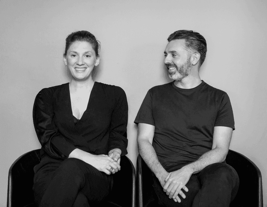 Directors Veronica and Costa, in black and white, interviewing