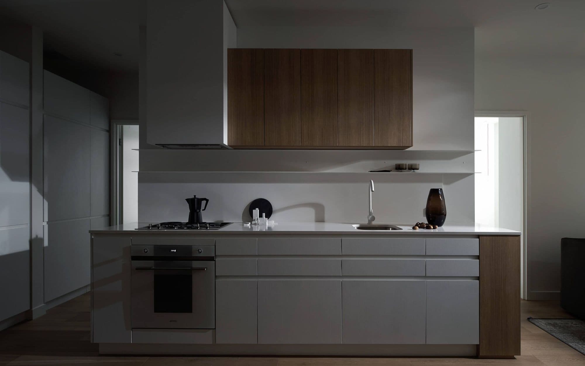 Kitchen in dim lighting, shadowplay on walls