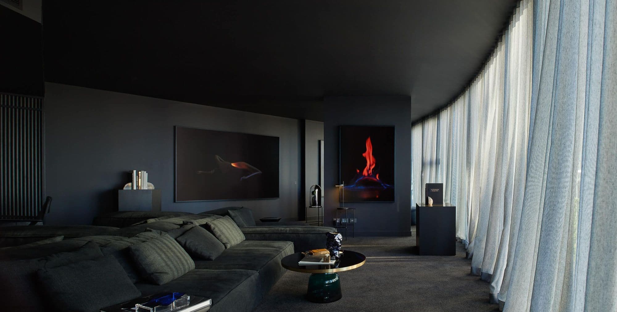 Loungreroom with closed curtains and dark tones
